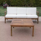 Ensemble canapé 3 places et table basse d'extérieur Abena en bois d'acacia avec coussins GDFStudio