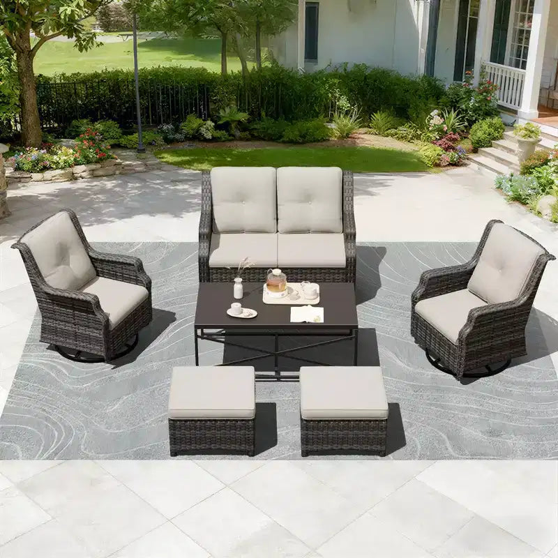 Ensemble modulaire extérieur UPTIOT : canapé 2 places, 2 fauteuils à bascule, 2 poufs et table basse pour une terrasse polyvalente