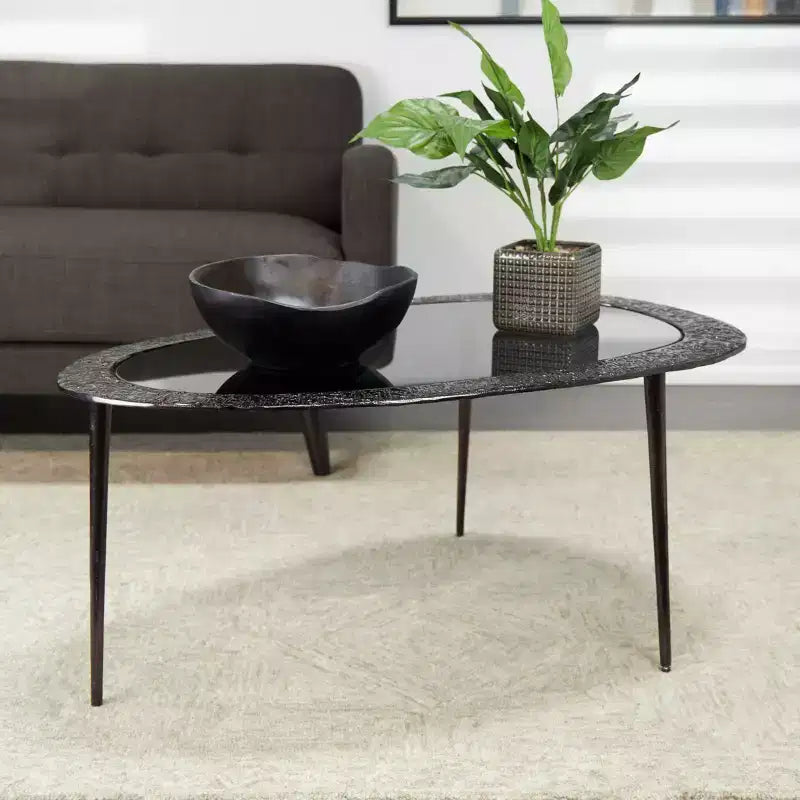 Table basse ovale en aluminium avec plateau en verre teinté et gravures noire : Intérieur, entièrement assemblée